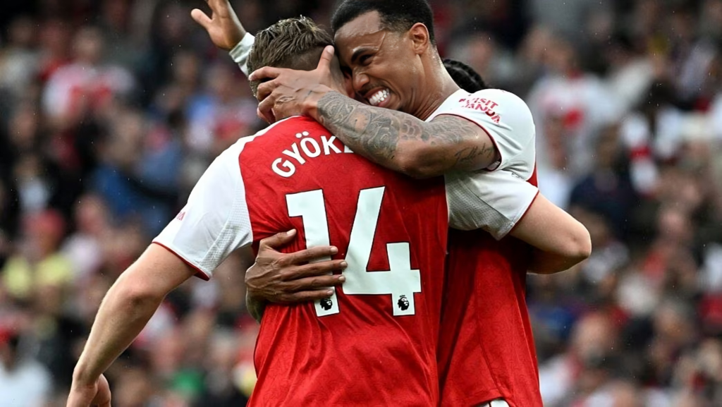 Arsenal players Gabriel Magalh&atilde;es and Viktor Gy&ouml;keres celebrating a goal against Fulham, with Gy&ouml;keres wearing the number 14 jersey.